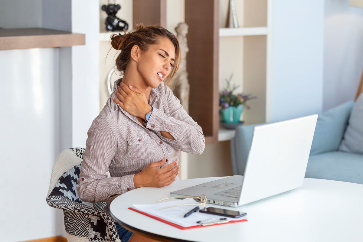 young-businesswoman-suffering-from-neckache-massaging-her-neck-while-sitting-her-working-place-home-office 1200x800